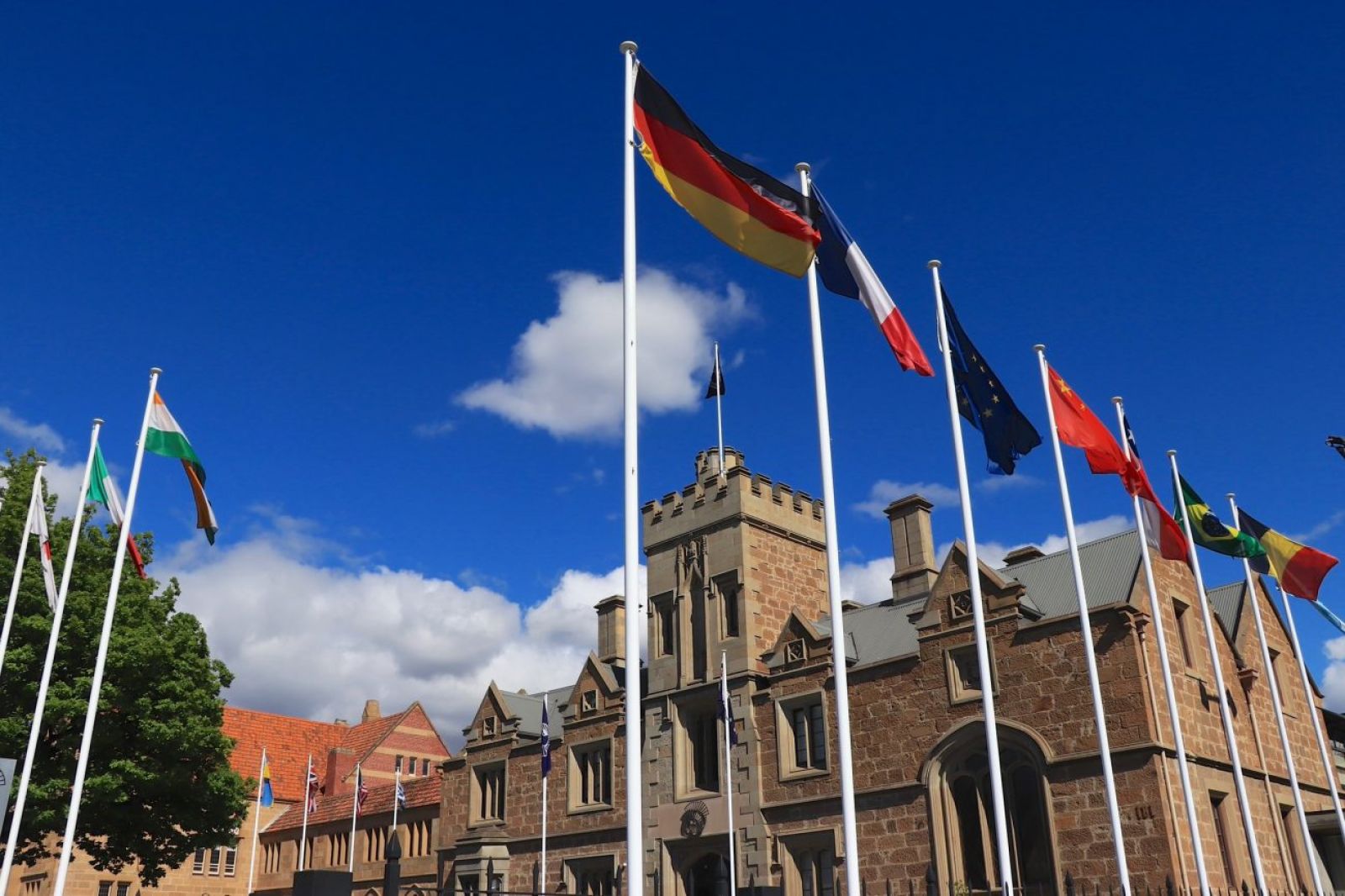 Various countries flags flying on flagpoles outside the Commission for the Conservation of Antarctic Marine Living Resources (CCAMLR) building in Hobart